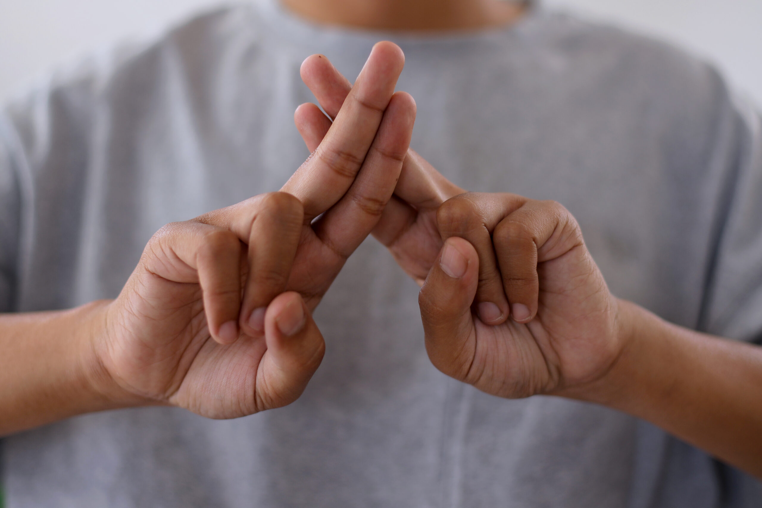 close up of young deaf man using sign language 2024 09 20 23 36 11 utc scaled